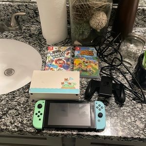 nintendo switch, mario and animal crossing, gaming controller, charging stand.